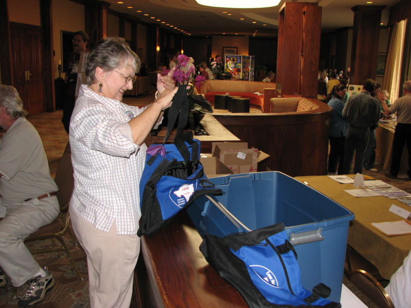 Margaret Ann Smith inspects a convention bag.